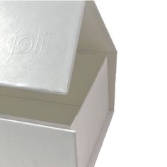 two white boxes sitting side by side on top of each other with the word joli written on them