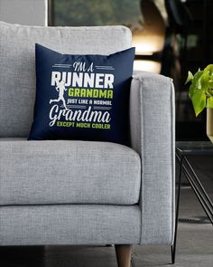 a couch with a pillow that says i'm a runner grandma