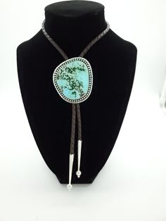 Stunning Chinese Oldstock Turquoise Bolo Tie. This piece features a gem grade Turquoise cabochon, set in sterling. Simple and timeless, this will certainly make a statement. The depth in this stone is just awesome.  All of the turquoise chosen for my bolo ties is absolutely some of the best old stock that can be found. Always priced fairly to ensure value, these are heirloom caliber stones. All acquired from the J. Julian estate collection. Mr. Julian's expertise and eye for beauty is evident in Turquoise Lariat Gemstone Jewelry, Western Blue Lariat Jewelry, Luxury Turquoise Cabochon Jewelry, Blue Lariat Western Style Jewelry, Southwestern Adjustable Jewelry With Stones, Blue Western Lariat Jewelry, Artisan Adjustable Turquoise Gemstone Necklace, Adjustable Southwestern Jewelry With Large Stone, Elegant Adjustable Turquoise Gemstone Necklace