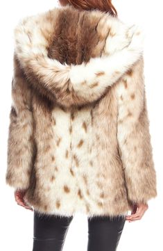 Style a chic outfit with this realistic looking faux fur hooded coat. Attached hood Long sleeves Open front Faux fur construction Lined Faux fur shell: 63% acrylic, 25% modacrylic, 12% polyester/back: 100% polyester/lining: 100% polyester Dry clean Imported Model’s stats for sizing: 5’11” height, 32” bust, 24” waist, 34” hips. Fur Coat With Hood, Fur Hooded Coat, Gold Fox, Faux Fur Hooded Coat, Fabulous Furs, Fur Hood Coat, Hooded Faux, Check Coat, Fake Fur