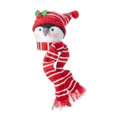 a stuffed bird wearing a red and white scarf