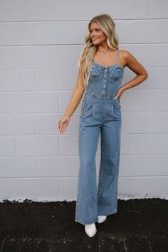 DOORBUSTERS EXCLUDED FROM DISCOUNT CODES Elevate your wardrobe with our new Dally Denim Jumpsuit. The adjustable straps provide a customizable fit, while the bustier style top and button accents add a touch of chic. With a convenient side zipper closure, this jumpsuit effortlessly combines style and functionality! 90% cotton, 10% polyester Inseam: 31" Model is 5'6" with a 34" bust, 27" waist, and 36" hips and wearing a small. Size recs: S 2-4 M 4-6 L 8-10 Loungewear Summer, Dresses By Length, Denim Jumpsuit, Short Rompers, Top Sales, Discount Codes, Skirt Pants, Set Dress, Side Zipper