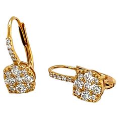 These beautiful diamond cluster earrings are perfect for everyday and special occasions! Sparkling white diamonds set in 18k yellow gold form elegant drops that sit just below the ear lobe, beneath a delicate line of petite diamonds. Comfortable 18k wire backs are secured with hinged lever backs. Earrings measure 5/8" in length and 1/4" in diameter. Simple yet sophisticated, you'll reach for these earrings when you want the perfect finishing touch to any outfit! 28 round brilliant-cut diamonds, Luxury Fine Jewelry With Lever Back, Luxury Dangle Earrings With Lever Back, Luxury Lever Back Earrings For Women, Luxury Elegant Diamond Earrings With Lever Back, Modern Luxury Earrings With Lever Back, Luxury Modern Earrings With Lever Back, Luxury Lever Back Anniversary Earrings, Luxury Diamond Drop Earrings With Lever Back, Luxury Round Diamond Earrings With Lever Back