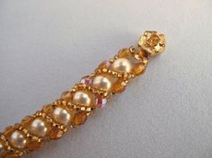 Crystal Pearl Bracelet Wrapped with Gold Beads by ArtbyLea on Etsy, $25.00 Feb 8, Crystal Pearls, Bead Designs, Jewelry Diy, Gold Beads, Pearl Bracelet, Gold Finish, Seed Beads, Beaded Jewelry