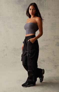 PacSun offers comfort and style in their new Extreme Nylon Cargo Pants. Designed for the bold and adventurous, these pants push the boundaries with their innovative design, combining zipper cargo utility pockets with a lightweight nylon construction. They get finished off with a flattering low-rise, a comfortable baggy fit, and adjustable drawcords at the waist and ankles.


	Solid color pants
	12" rise
	30" inseam
	Lightweight construction
	Low-rise
	Drawstring waistband
	Cargo zipper Cargo Pants Adjustable Waist, Fashion Library, Nylon Cargo Pants, Rave Fits, Slim Sweatpants, Color Pants, Camo Cargo Pants, All Jeans, Solid Color Pants