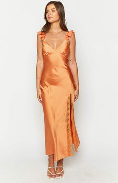 Orange Satin Formal Maxi Dress

How to style:
Elevate your formal look with the Wendy Orange Maxi Dress (). Crafted from light weight satin complete with a left leg split and lace trim, it's perfect for special occasions. Style with strappy heels for a feminine and chic formal () look.

 
Features:


  
 * Maxi length 
 * Invisible left side zip 
 * Light weight satin material 
 * Slight stretch 
 * Bias cut 
 * V neckline 
 * Left leg split with lace trim 
 * Bust lined 
 * Body unlined 
 * Chi Orange Satin Dress, Formal Maxi Dress, Prom Midi Dress, Orange Maxi Dress, 60's Dress, Bias Cut Dress, Orange Satin, Leg Split, Semi Formal Dresses