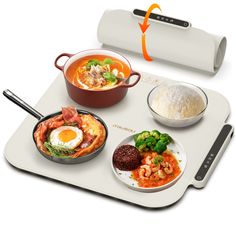 a tray with different types of food and utensils on it, including rice