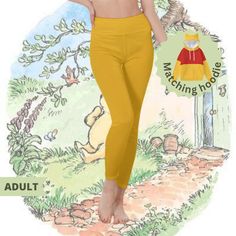 a woman in yellow pants is posing for the camera with her hand on her hip