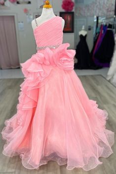 a pink dress on display in a store