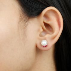 Product Details The Freshwater Pearl and Ruby Stud Earrings are a fabulous choice you wont be able to resist no matter what your style is. Featuring Round Shape Freshwater Pearl while Round Shape Diamonds studded as Halo and Round Ruby adds a touch of color. These Pearl Earrings are secure comfortably with screw backs. Celebrate any occasion with these shimmering Stud Earrings that can easily be worn to top off any casual, formal, or party look. Product Information SKU SHP-EARRINGS092021380 Weig Pearl And Ruby Earrings, Ruby And Pearl Earrings, Rose Gold Ruby Round Earrings, Round Ruby Gemstone Earrings, White Ruby Round Earrings, Ruby Stud Earrings, Ruby Earrings Studs, Party Look, Diamond Halo