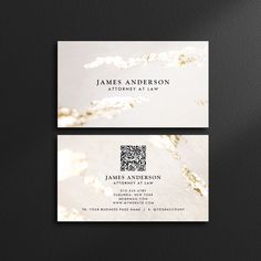 two business cards with gold foil on them