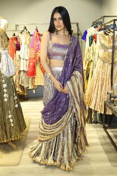 Metallic gold, purple palazzo saree with textured pattern and gota work on waistband. Paired with textured padded blouse and flared drape.
Components: 3
Pattern: Embroidery
Type Of Work: Gota
Neckline: Sweetheart neck
Sleeve Type: Sleeveless
Fabric: Palazzo Saree and Blouse: Metallic Tissue, Dupatta: Metallic Striped Tissue, Lining: Artificial Crepe
Color: Gold,Purple
Other Details: 
Length: 
Palazzo Saree: 42 inches
Blouse: 14 inches
Approx. product weight: 4 kgs
Occasion: Destination Wedding - Palazzo Saree, Gold Dupatta, Drape Lehenga, Bhumika Sharma, Tissue Dupatta, Skirt Saree, Dhoti Saree, Saree And Blouse, Gota Work