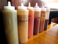 several bottles are lined up on a table