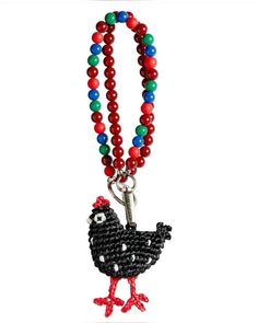 a beaded necklace with a chicken on it