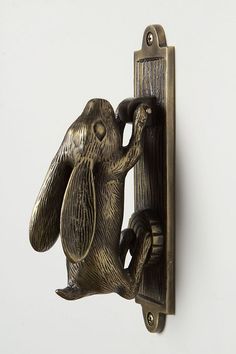 a metal door handle with an animal on it