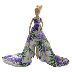 PRICES MAY VARY. Affordable and Adorable, this Purple Blossom Gown for 11.5-inch fashion dolls is a true work of art for adult doll collectors or mature users over 12 years old. Tailored exclusively for those who see their dolls as more than toys, our doll clothes add tangible value and unparalleled style to your cherished collection. (Doll not included.) Ball Gown Purple, Long Tulle Dress, Purple Blossom, Gown Purple, Tulle Dress Long, Dress Train, Purple Floral Print, Lavender Floral, Wrap Maxi Dress