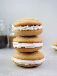 three cookies stacked on top of each other with frosting and icing around them