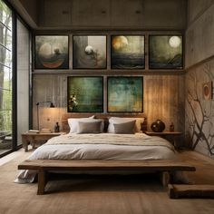 a large bed in a room with pictures on the wall