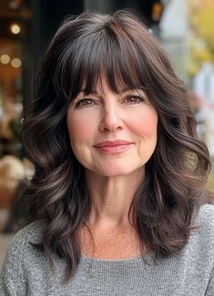 Classic Soft Waves with Bangs, medium-length layered haircuts, mid-length hairstyle for women Over 60 60s Mid Length Hair, Mid Length Hair With Bangs And Layers Wavy, Women’s Medium Length Haircut With Bangs, Mid Length Wolf Cut Wavy Hair, Waves With Bangs, Hairstyle For Women