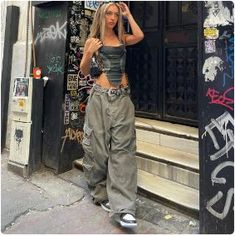 Join the fashion revolution with this Y2K Baggy Pants! Introducing our Y2K Baggy Pants in a stylish grey hue, the epitome of Y2K fashion. These wide-leg trousers feature a low waist and unique patchwork design, delivering a blend of streetwear, hip-hop, and grunge styles. Crafted for women who embrace fashion as a form of self-expression, these pants exude the spirit of the 2000s era while ensuring comfort and individuality. Elevate your fashion game with these Y2K Pants, and make a bold statement in the world of women's fashion. Material: Cotton Closure type: Button Fly Style: Streetwear and Y2K Free delivery 👖 Size (cm) 👖 Size Waist Hips Length S 66 119 105 M 70 123 107 L 74 127 109 Pakaian Hipster, Niche Fashion, Streetwear Outfit Ideas, Streetwear Girl, Christmas Outfits Women, Looks Street Style, Y2k Outfits, Streetwear Fashion Women, Autumn Fashion Casual