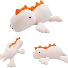 three stuffed animals with orange bows on their heads and tails, one laying down the other lying down