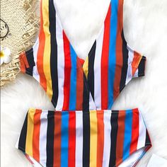 New With Tags Size Small Never Worn Bold One-Piece Swimsuit Is Made From A Chinlon And Spandex Fabric Blend For An Extra Smooth Feel. It Features A Plunging Neckline And Ties At The Back For Adjustable Support. The Bold Colors Are Bright And On Trend For A Beachside Look That Can Be Dressed Up Or Down. Multicolor Lined Swimsuit For Poolside, Multicolor Lined One Piece For Poolside, Multicolor One-piece Swimwear With Lined Body For Poolside, Multicolor One-piece Swimsuit With Lined Body For Poolside, Multicolor One Piece With Lined Body For Poolside, Summer Beach Color Block Bodysuit, Summer Multicolor Bodysuit For Beach Season, Multicolor Lined Bodysuit For Poolside, Multicolor One Pieces For Pool With Lined Body