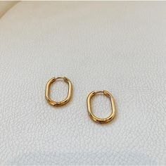 Minimal and simple gold oval hoop earrings. These earrings are made from stainless steel with 18k gold plated. The oval style hoops are unique in style yet dainty enough for everyday wear. They will certainly elevate your daily outfits with an effortless chic look. ………………………………….D E T A I L S• Materials: Stainless steel, 18k gold plating.• Earrings length: 0.8 inches (22 cm)• Earrings Width: 0.5 inches (15 mm)• This product is hypoallergenic, water and tarnish resistant Trendy Oval Metal Hoop Earrings, Modern Oval Tarnish Resistant Huggie Earrings, Gold Oblong Hoop Earrings For Everyday, Gold Oblong Huggie Earrings For Everyday, Minimalist Oval Hoop Earrings Tarnish Resistant, Minimalist Oval Tarnish Resistant Hoop Earrings, Minimalist Oval Tarnish-resistant Hoop Earrings, Trendy Oval Everyday Earrings, Minimalist Tarnish-resistant Oval Hoop Earrings