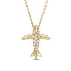 For the world traveler - or the dreamer of far-off lands - this shimmering fashion pendant keeps the next exciting itinerary at hand. Crafted in warm 10K gold, this intricately detailed airplane is dotted with sparkling diamond accents that catch the eye. A brilliant reminder of the adventures yet to come, this pendant is finished with a polished shine and suspends along an 18.0-inch cable chain that secures with a spring-ring clasp. Luxury Silver Jewelry For Travel, Elegant Sterling Silver Necklace For Travel, Yellow Gold Pendant Necklaces For Travel, Luxury Yellow Gold Jewelry For Travel, Yellow Gold Pendant Jewelry For Travel, Airplane Pendant, Fashion Pendant, Sparkling Diamond, Yet To Come