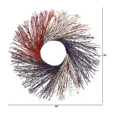 a circular sculpture made out of red, white and blue sticks on a white background