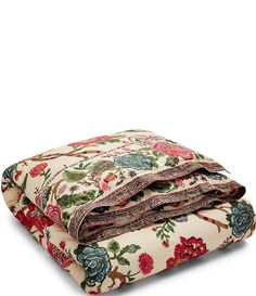 the floral print sheets are folded up on top of each other and ready to be used