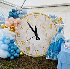 there is a large clock with balloons on it