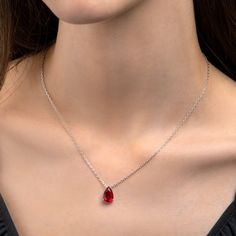 Features: * Stylish red necklace with a teardrop pendant with an adjustable 18" chain, including 2-inch extension links. * 925 Sterling silver necklace for women with a pear-shaped red pendant. Simple stone necklaces for women with 8mm by 12mm vivid red pear-shaped cubic zirconia stone * Solid silver chain and pendant. This elegant red necklace for women is made from Rhodium-plated 925 Sterling Silver. * High-quality 925 sterling silver handmade necklaces for women. All our sterling silver jewel