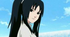 a woman with long black hair standing in front of a blue sky and white clouds