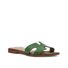 Steve Madden-Hadyn Sandal Look trendy and comfortable in the Hayden sandal by Steve Madden. Cut-out details create an edgy appeal to the leather sandal, completed by a square open toe. Summer Square Toe Mules With Buckle Closure, Modern Open Toe Sandals For Vacation, Green Modern Sandals With Single Toe Strap, Modern Green Sandals With Single Toe Strap, Green Leather Summer Slides, Green Leather Slides For Summer, Summer Square Toe Mules With Leather Footbed, Trendy Sandals With Buckle Closure And Square Toe, Trendy Sandals With Square Toe And Buckle Closure