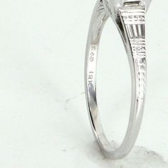 Art Deco era engagement ring (circa 1920s to 1930s), crafted in 18 karat white gold.  Centrally mounted estimated 0.85 carat Old European cut diamond (estimated at K colour and VS2 clarity).  Embossed geometric pattern on the side shoulders, a design hallmark of the Art Deco period.   The ring is in excellent condition.  Particulars:  Weight: 2.4  grammes  Stones: Centrally mounted estimated 0.85 carat Old European cut diamond (estimated at K colour and VS2 clarity).  Size & Measurements: The ri Diamond Ring Vintage, Art Deco Period, European Cut Diamonds, Art Deco Era, Ring Vintage, Hallmark, Diamond Cuts, Diamond Ring, Period