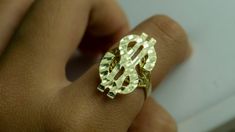 [ Description ] - 100% Brand New & High Quality $ Sign Dollar Sign Ring - Material: 10K Gold - Color: Yellow Gold - Size: 6 - 13 ※ As rings are resized into bigger sizes, more gold is added, and thus it makes additional cost. - Weight ▷ Small: 2.5grams ▷ Large: 4.5grams ※ This is an approximate size & weight. Please allow up to ±10% difference. ※ The weight depends on the ring size. Gold Nugget Jewelry, Money Rings, Gold Money, Money Sign, Dollar Sign, Letter Ring, Jewelry Accessories Ideas, Gold Nugget, Gold Flats