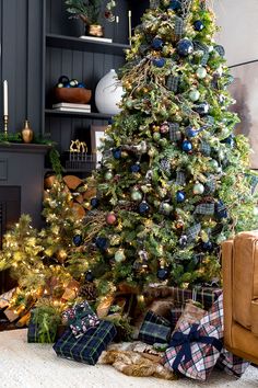 a decorated christmas tree with presents under it