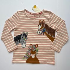 Nwt Mini Boden -- Your Little Horse Lover Will Want To Wear This Sweet Horse-Themed Pink Striped T-Shirt Every Day Of The Week! Three Friendly Horses Are Appliqued And Embroidered On The Front, And One More Is Hiding On The Back! Can Be Paired With A Twirly Corduroy Skirt And Floral, Pin Dot, Or Striped Leggings, Or Solid Corduroy Pants, Jeans, Or Even Under A Jumper. Remember That Mini Boden's Signature "Hotchpotch" Style Lets Her Wear Any Patterns Together So Long As There's A Shared Colorway. Playful Pink Cotton Shirt, Playful Pink Crew Neck Top, Fun Long Sleeve Pink Shirt, Playful Pink Cotton Tops, Playful Pink Cartoon Print Top, Cute Pink Shirt For Fall, Cute Pink Fall Shirt, Pink Cartoon Print Tops For Fall, Pink Tops With Cartoon Print For Fall