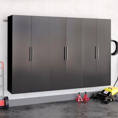 This storage system brings wall-mounted cabinetry to your garage, basement, or workspace. Each piece is made from engineered wood with a neutral finish and features a streamlined rectangular silhouette. This storage system includes three connected double-door cabinets with 15 combined shelves, nine of which are adjustable. Each shelf holds up to 40 lbs., offering space for everything from toolboxes to sports equipment. This cabinet set comes with wall-mounting hardware to aid with setup and ... Ikea Garage Storage, Ikea Garage, Grooming Room, Sports Equipment Storage, Garage Storage Cabinet, Workspace Storage, Garage Basement, Future Kitchen, Garage Storage Organization