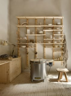 a room with wooden shelves and various items on the wall, including an ice bucket