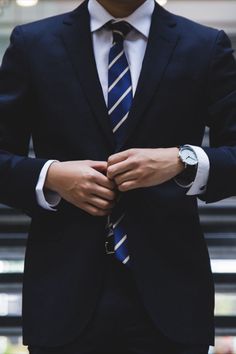 a man wearing a suit and tie with the words direct profits written on his chest