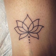 a lotus flower tattoo on the ankle