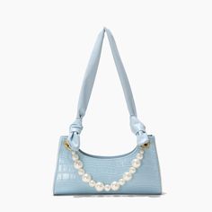 This baguette bag sure can define the fashion trend in 2021 this summer. Featured vegan leather Croc print design Stable tie strap Extra pearls chains High-quality Metals Solid smooth zipper closure Careful lining Bag measures: L28 * W6 * H9 cm Cheap Blue Bags With Cute Design, Luxury Blue Baguette Bag For Women, Cute Cheap Light Blue Bag, Luxury Light Blue Satchel Bag, Luxury Light Blue Shoulder Bag With Gold-tone Hardware, Luxury Light Blue Shoulder Bag With Adjustable Strap, Luxury Light Blue Bags With Detachable Strap, Luxury Light Blue Top Handle Bag, Luxury Light Blue Bags For Daily Use