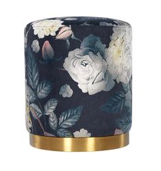 a black and white floral candle holder with gold trim