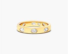 14K Yellow Gold Bezel Set Oval Diamond Ring. The smoothness of the metal is highlighted by the sparkle of the diamonds. Wear it alone or up the sparkle by pairing it with multiple stackable rings. Luxury Oval Stackable Rings, Oval Stackable Rings With Rose Cut Diamonds For Anniversary, Luxury Oval Yellow Gold Stackable Rings, Luxury Yellow Gold Oval Stackable Rings, Anniversary Stackable Rings With Rose Cut Diamonds, Luxury Oval Diamond Stackable Rings, Formal Oval Stackable Rings With Rose Cut Diamonds, Oval Stackable Rings With Diamond Accents For Anniversary, Gold Oval Diamond Stackable Rings