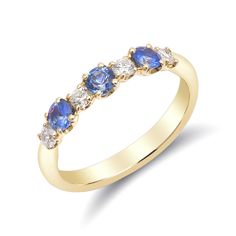 a yellow gold ring with blue and white stones