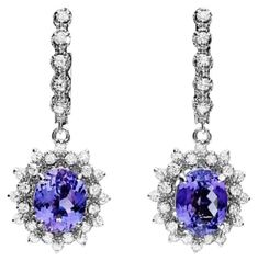 6.40Ct Natural Tanzanite and Diamond 14K Solid White Gold Earrings Total Natural Oval Tanzanite Weight: 4.90 Carats Tanzanite Measures: 10.00 x 8.00mm Total Natural Round Cut White Diamonds Weight: Approx. 1.50 Carats (color G-H / Clarity SI1-SI2) Total Earrings Weight is: Approx. 7.4 grams Disclaimer: all weights, measurements and colors are approximate and may vary slightly from the listed dimensions or as seen in the image. All pictures are magnified to show the smallest of details. Please, r Peridot Necklace, Tanzanite Diamond, Natural Tanzanite, White Gold Earrings, 14k White Gold Ring, White Diamonds, Perfect Ring, Quality Diamonds, Tanzania