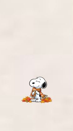 a cartoon dog with a scarf on it's neck sitting in front of an autumn background