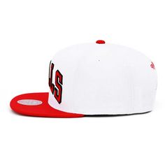 Cheer on your Bulls with this Chicago Bulls Core Basic White & Red Snapback Cap from Mitchell & Ness! This snapback has a structured fit throughout, with a high crown, flat visor, and a snapback adjustable strap. It is white with a red visor and red accents, and features a large Bulls wordmark logo embroidered across the crown. Brand: Mitchell & Ness Material: 100% Polyester Embroidered graphics throughout High crown and flat visor Snapback adjustable strap Officially Licensed by NBA Red Baseball Cap With Flat Crown For Sports Events, Red Baseball Cap For Sports Events, Red Flat Crown Baseball Cap For Sports Events, Red Fitted Hat For Sports With Flat Crown, Red Fitted Hat With Flat Crown For Streetwear, Red Fitted Hat With Flat Crown For Sports, Red Flat Crown Baseball Cap For Baseball Season, Red Fitted Hat For Baseball With Flat Crown, Red Fitted Hat For Baseball Season