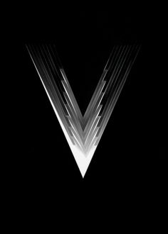 a black and white photo of the v logo on a dark background with lines coming out of it